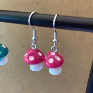 Small pink mushroom earrings.